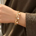 Elegant Gold Clover Bangle Close-Up.webp